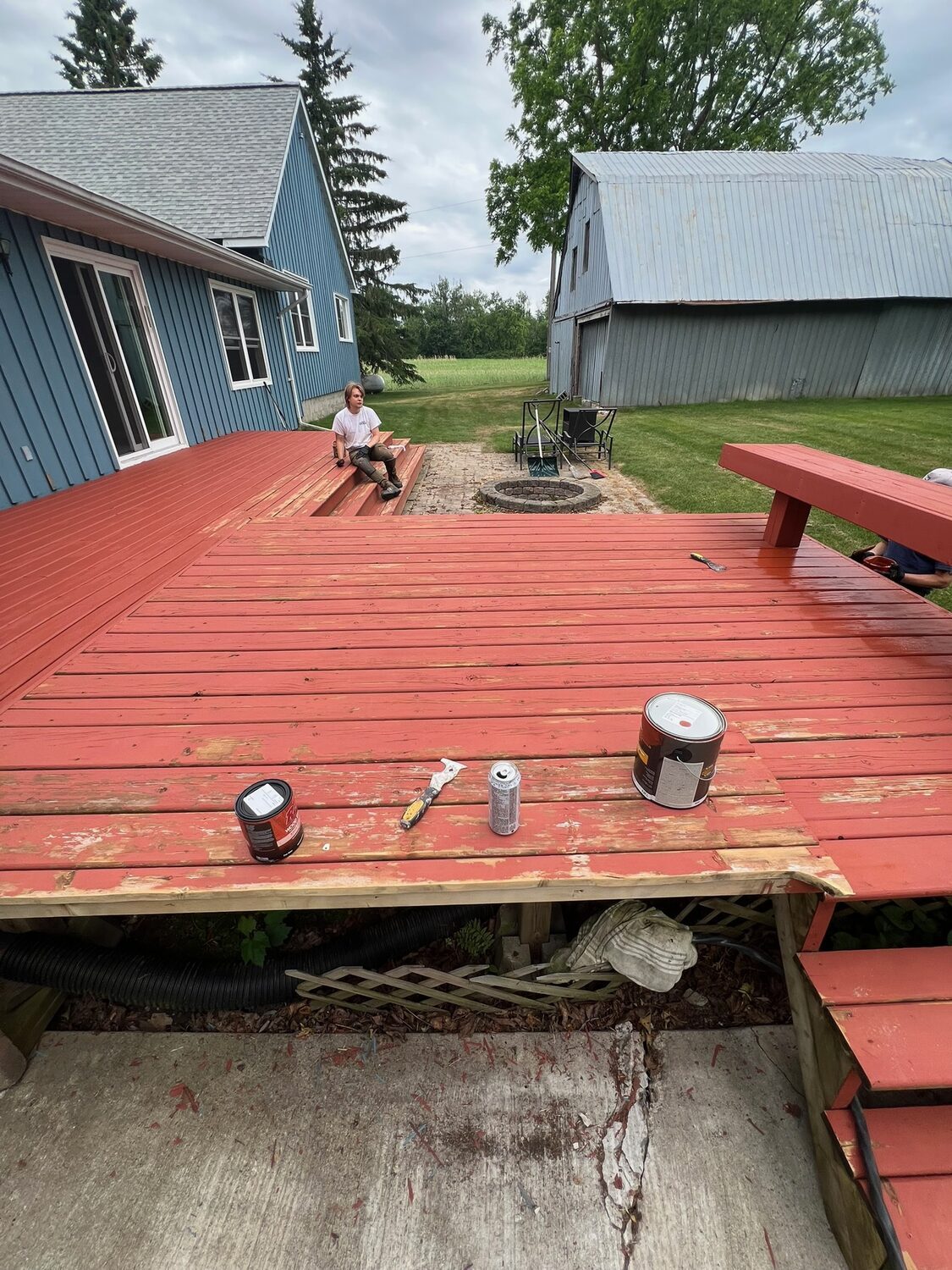 Worn deck with peeling finish before restoration