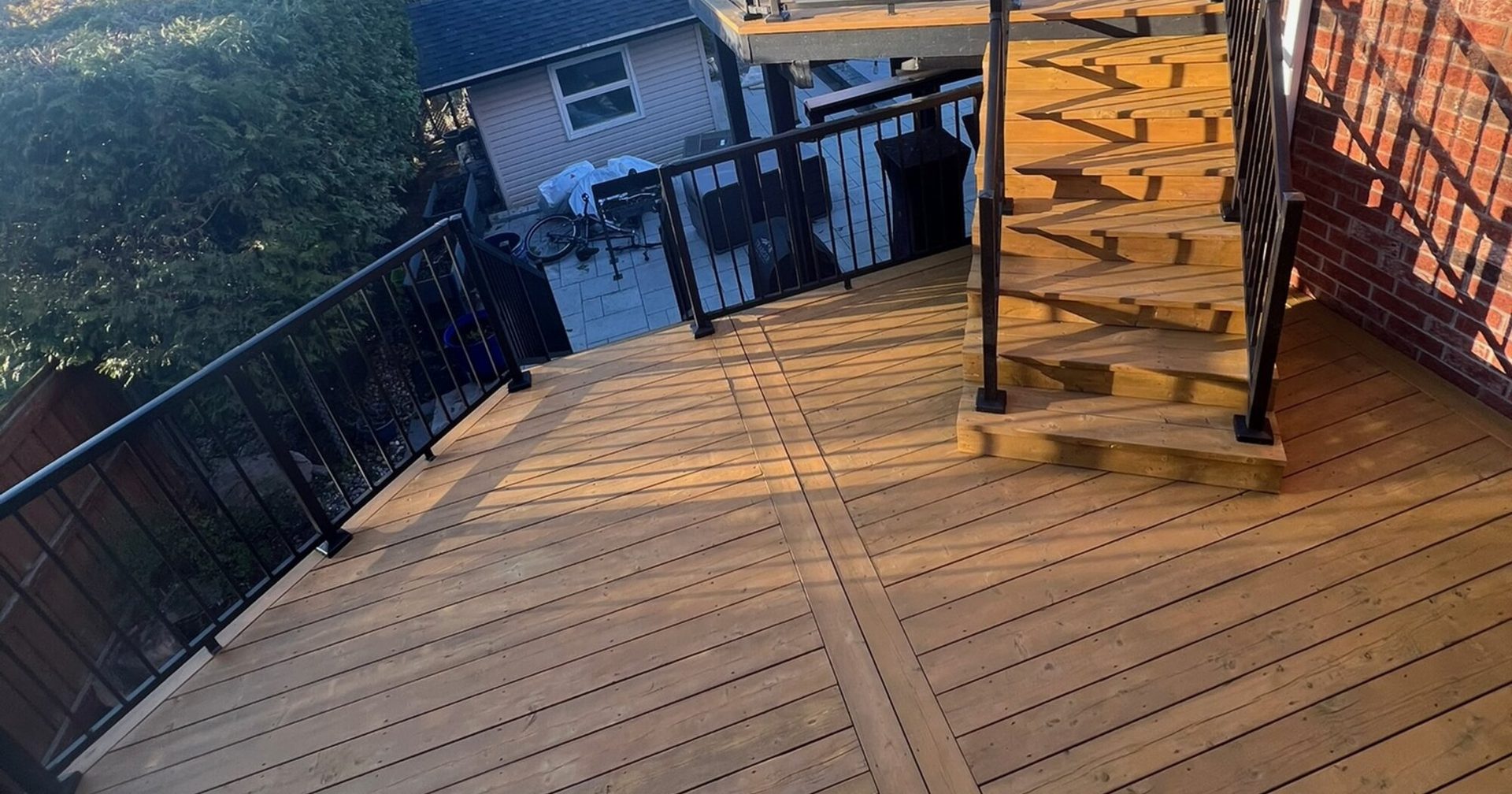 Freshly refinished backyard deck by Torres Exteriors